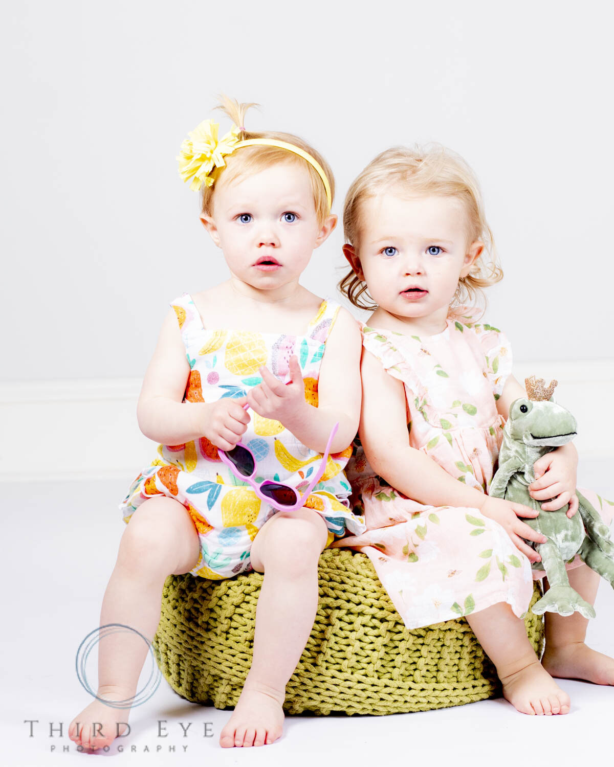 Two girl pose for a portrait photography session.