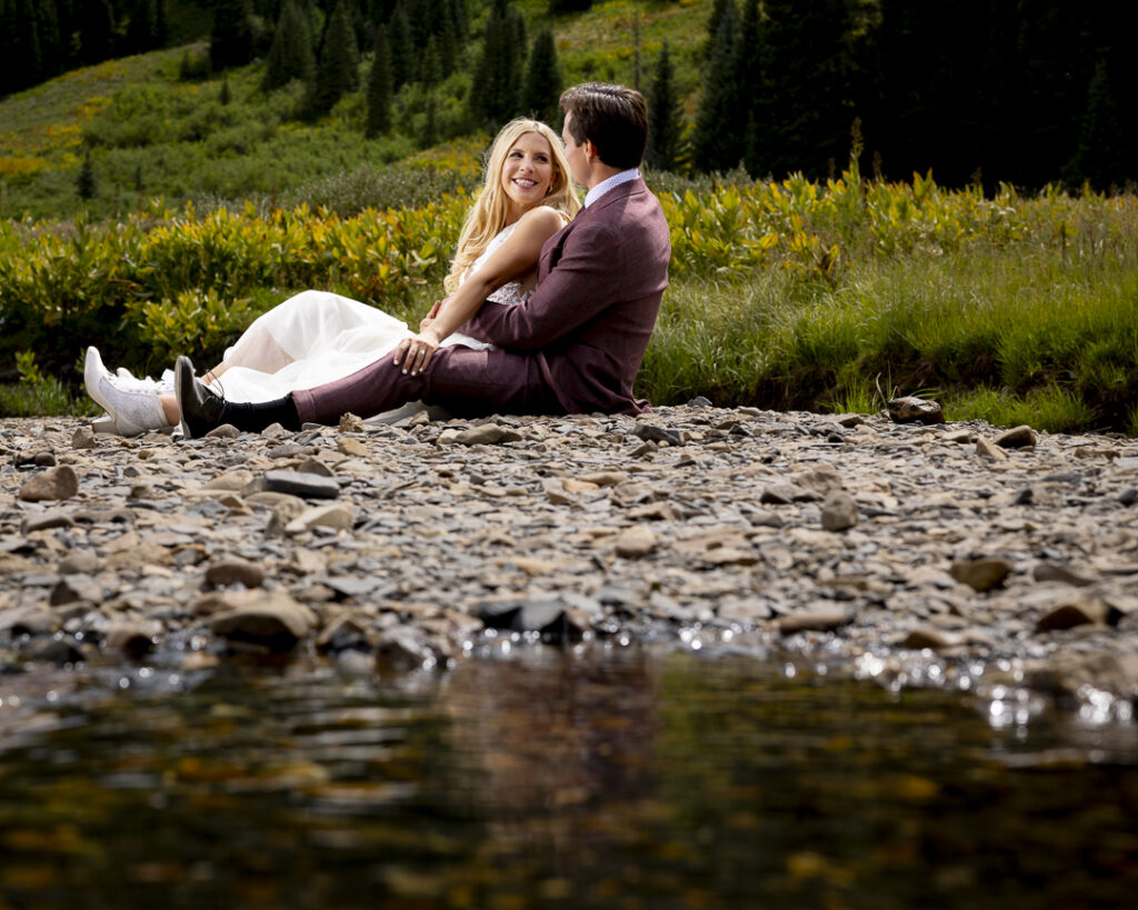 enjoy a riverside moment during your wedding day portraits by your local photographer