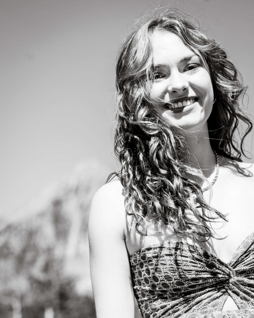 hair blowing in the wind at her senior photography session