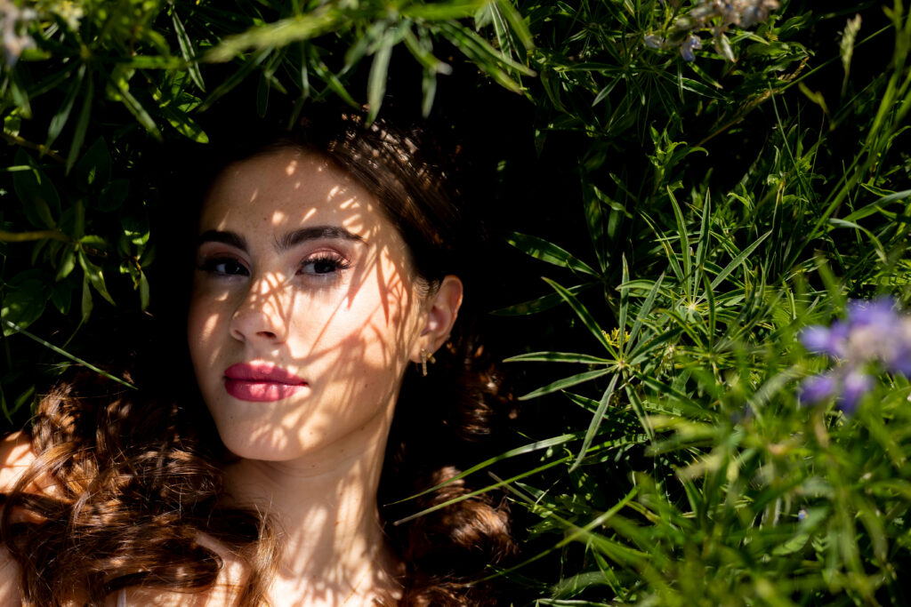 unique flower shadow on girls face for her senior pictures.