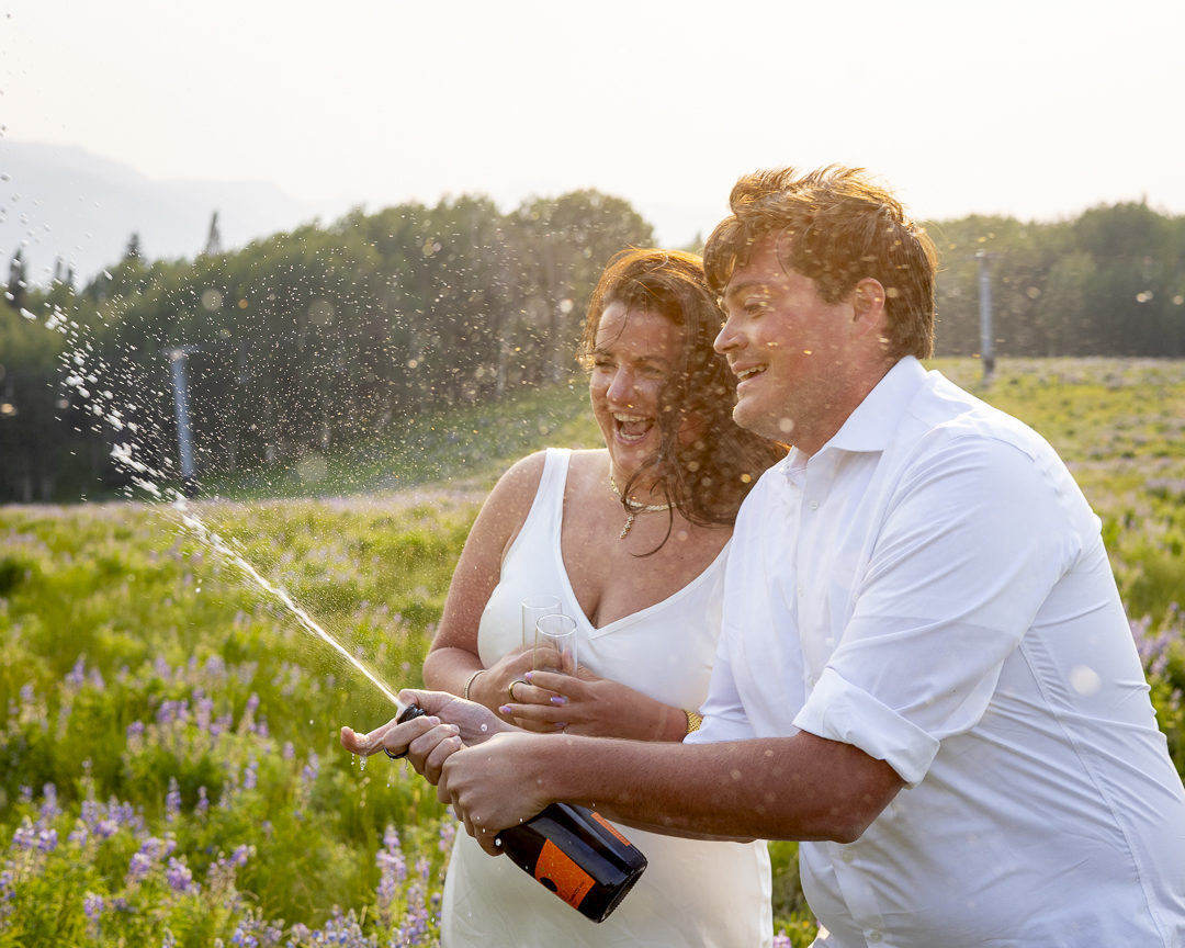 photo engagement session with champagne at umbrella bar